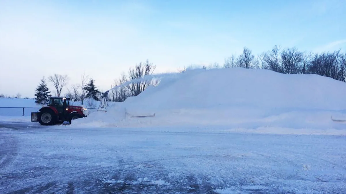 Ambient snow haulage & relocation scene in Guelph